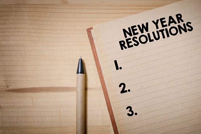 Blank New Year's Resolutions list with a pen lying next to it