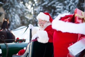 santa on his sleigh, about to deliver presents to children